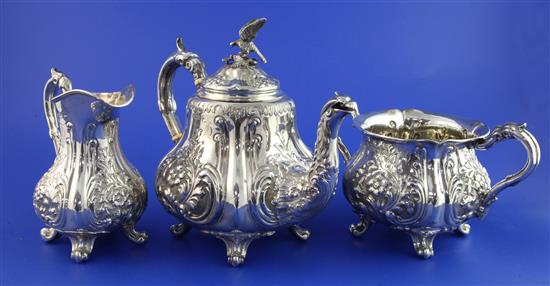 A late Victorian three piece silver tea set by Walker & Hall, gross 42.5 oz.